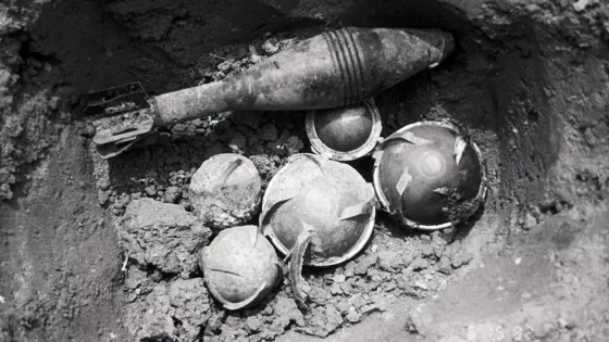 A collection of bomblets and other unexploded ordnance is ready for detonation in this 1992 photo. Addressing the problem of unexploded ordnance (UXO) left from the more than 2.2 million tons of bombs
